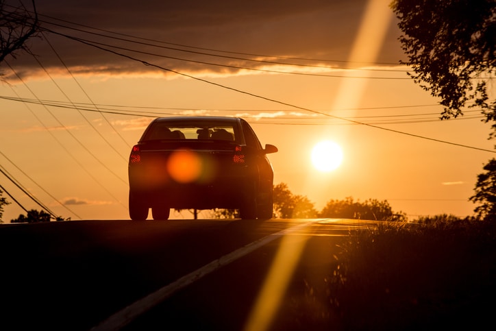 Car driving whilst the sun is setting